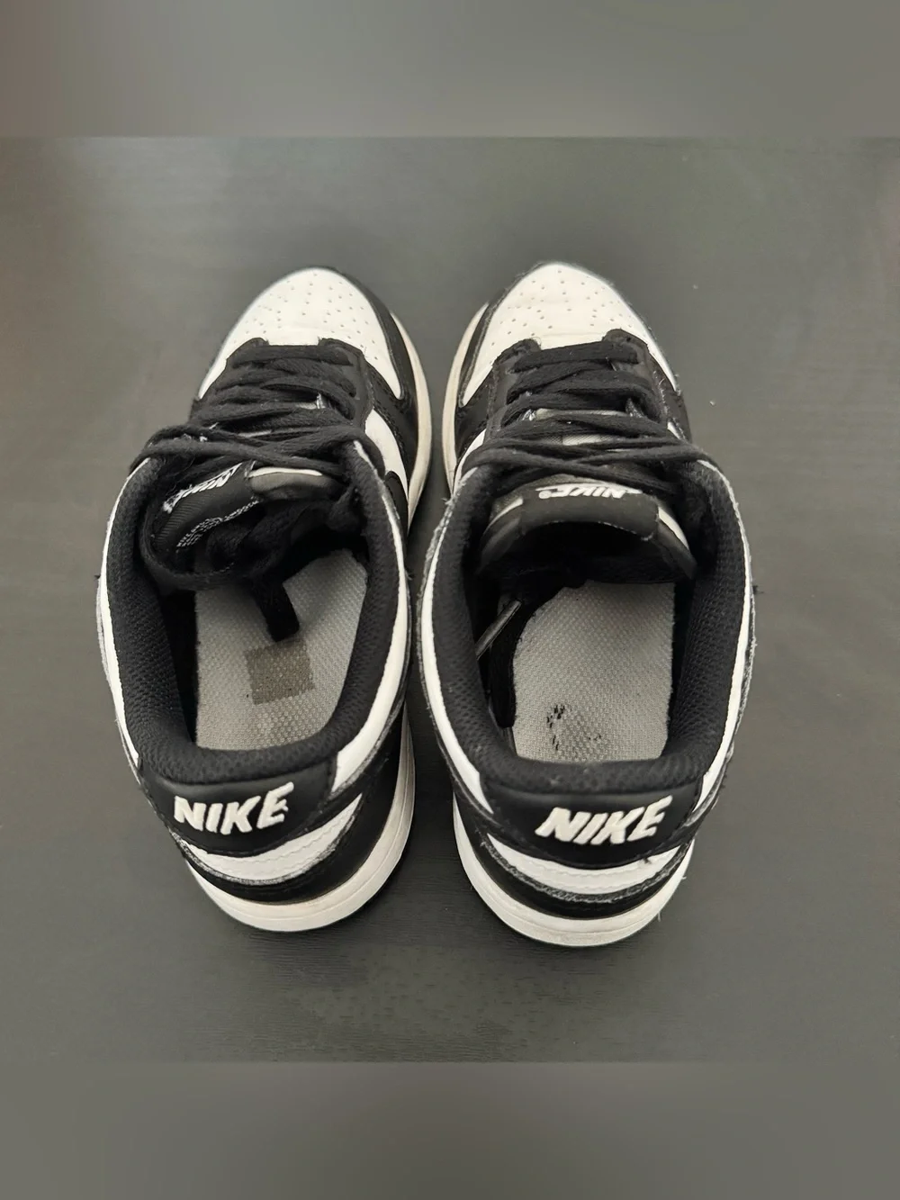 Children’s Nike Dunk Low black and white tennis shoes